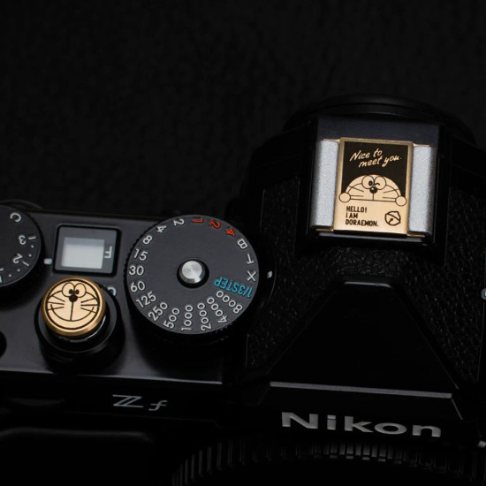 Doraemon Shutter Button & Hot Shoe Cover – Brass, CNC Machined, Hand-Polished (Threaded & Stick-On Versions) Doraemon Shutter Button & Hot Shoe Cover – Brass, CNC Machined, Hand-Polished (Threaded & Stick-On Versions)