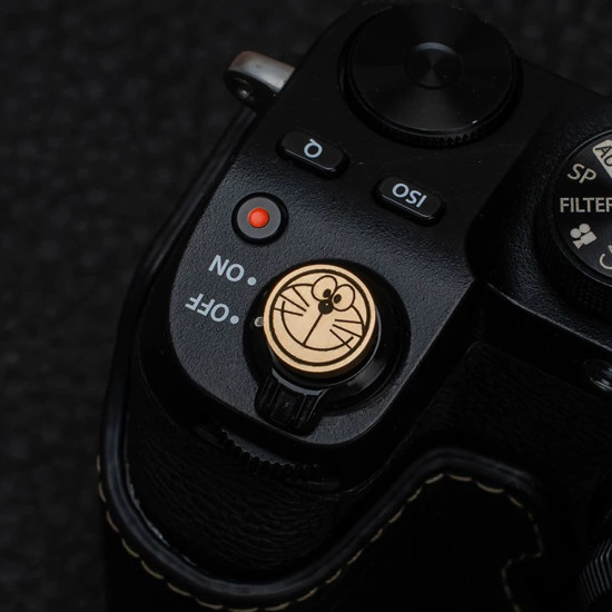 Doraemon Shutter Button & Hot Shoe Cover – Brass, CNC Machined, Hand-Polished (Threaded & Stick-On Versions) Doraemon Shutter Button & Hot Shoe Cover – Brass, CNC Machined, Hand-Polished (Threaded & Stick-On Versions)