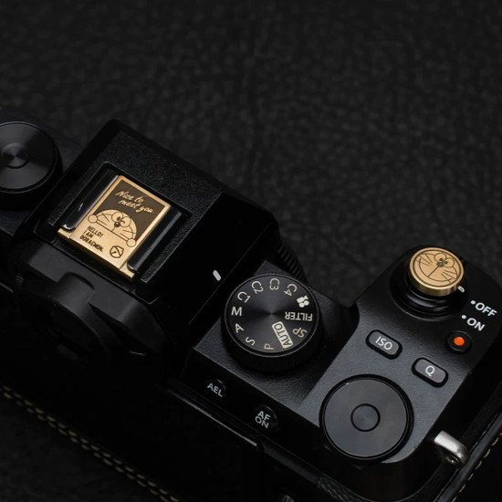 Doraemon Shutter Button & Hot Shoe Cover – Brass, CNC Machined, Hand-Polished (Threaded & Stick-On Versions) Doraemon Shutter Button & Hot Shoe Cover – Brass, CNC Machined, Hand-Polished (Threaded & Stick-On Versions)