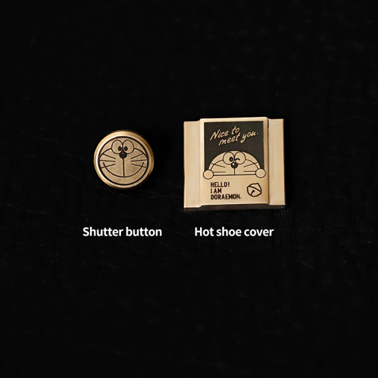 Doraemon Shutter Button & Hot Shoe Cover – Brass, CNC Machined, Hand-Polished (Threaded & Stick-On Versions) Doraemon Shutter Button & Hot Shoe Cover – Brass, CNC Machined, Hand-Polished (Threaded & Stick-On Versions)